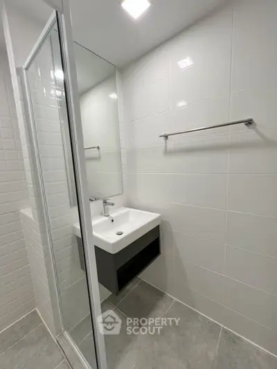 Modern bathroom with sleek design and glass shower enclosure