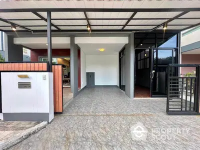 Modern house entrance with covered parking and sleek design