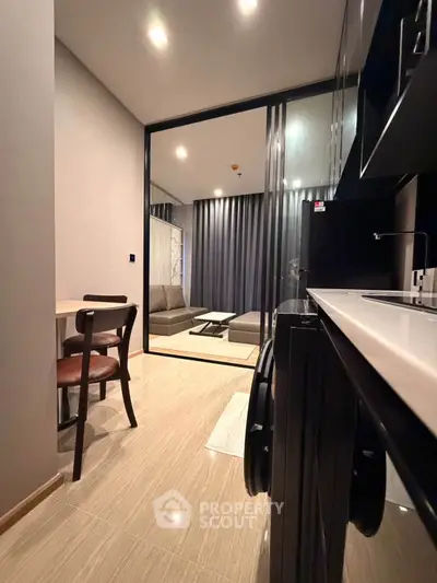 Modern apartment interior with sleek kitchen and cozy living area