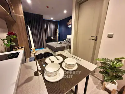 Modern studio apartment with stylish decor and cozy dining area