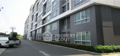 Modern apartment building exterior with clean lines and large windows
