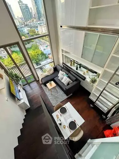 Modern loft apartment with high ceilings and stunning city view
