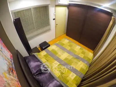 Cozy bedroom with modern decor and large window blinds