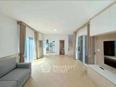 Spacious modern living room with natural light and stylish decor