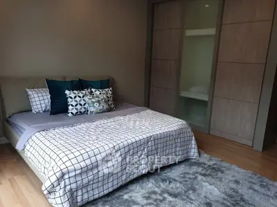 Elegant bedroom with stylish decor and cozy bedding