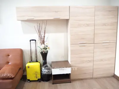 Modern interior with stylish wooden cabinets and leather sofa, perfect for contemporary living spaces.