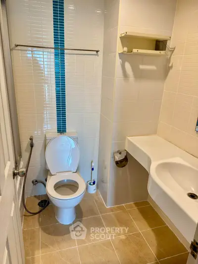 Modern bathroom with sleek fixtures and stylish tile design, perfect for contemporary living.