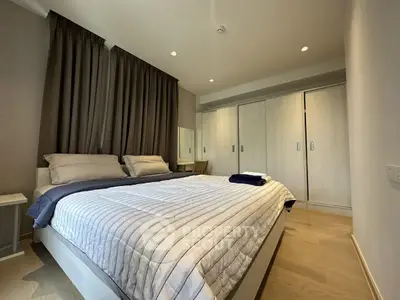 Modern bedroom with cozy bedding and ample closet space