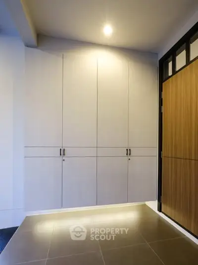 Modern interior with sleek storage cabinets and elegant lighting