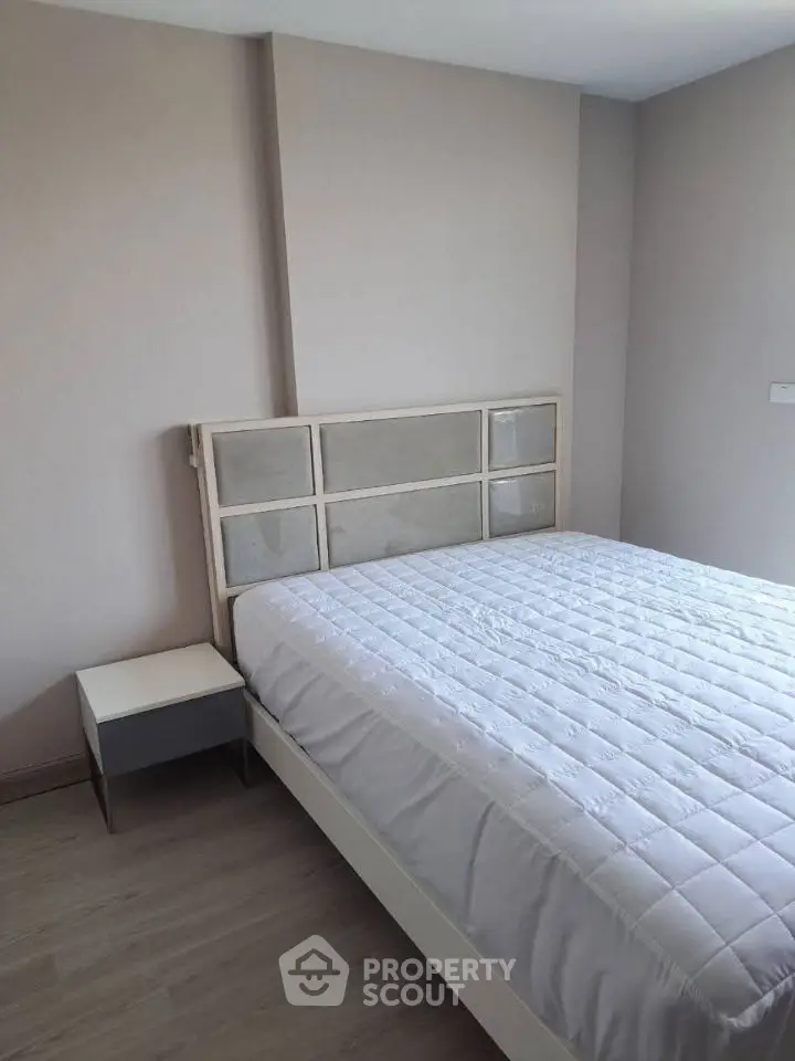 Modern minimalist bedroom with stylish bed and neutral decor