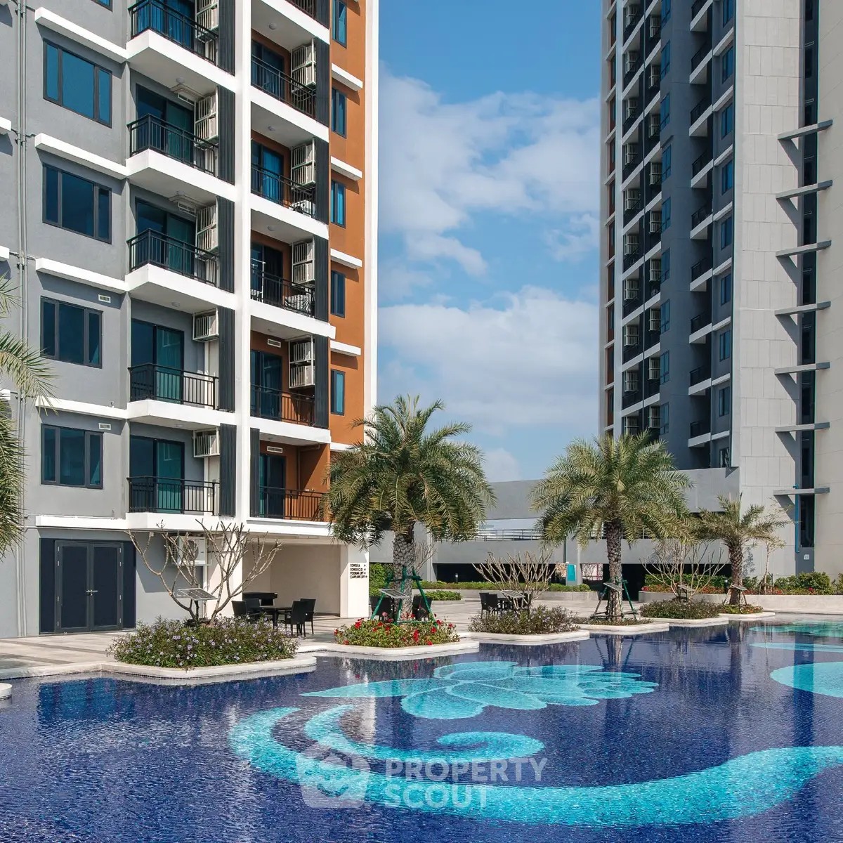 Luxurious apartment complex with stunning pool and modern architecture