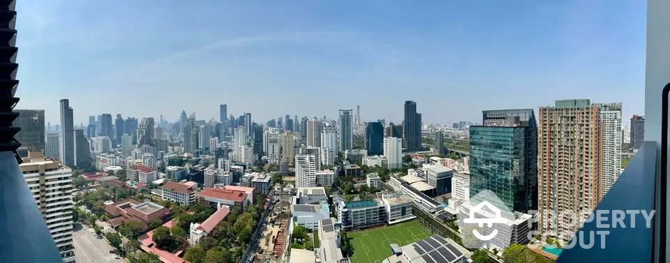 Stunning panoramic cityscape view from high-rise building balcony