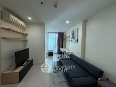 Modern living room with sleek furniture and natural light, perfect for urban living.