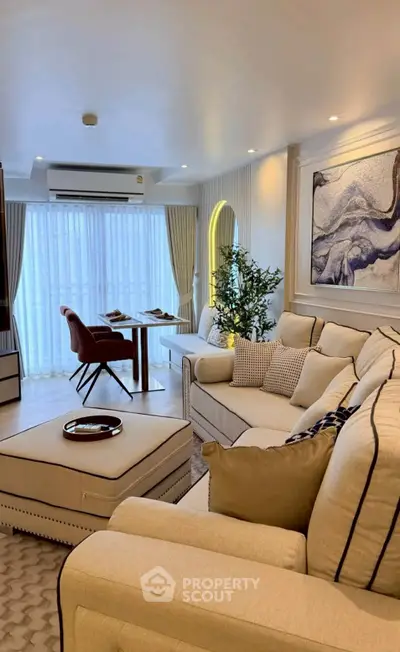 Luxurious living room with elegant decor and cozy seating area, perfect for relaxation and entertainment.