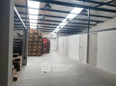 Spacious warehouse interior with high ceilings and ample storage space.