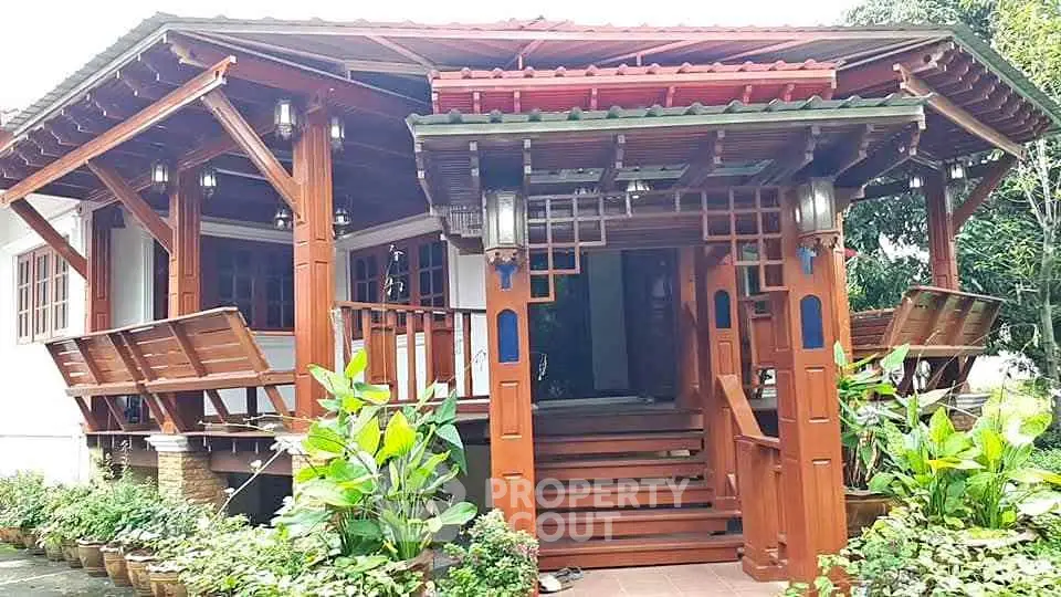 Charming wooden house with lush greenery and inviting entrance