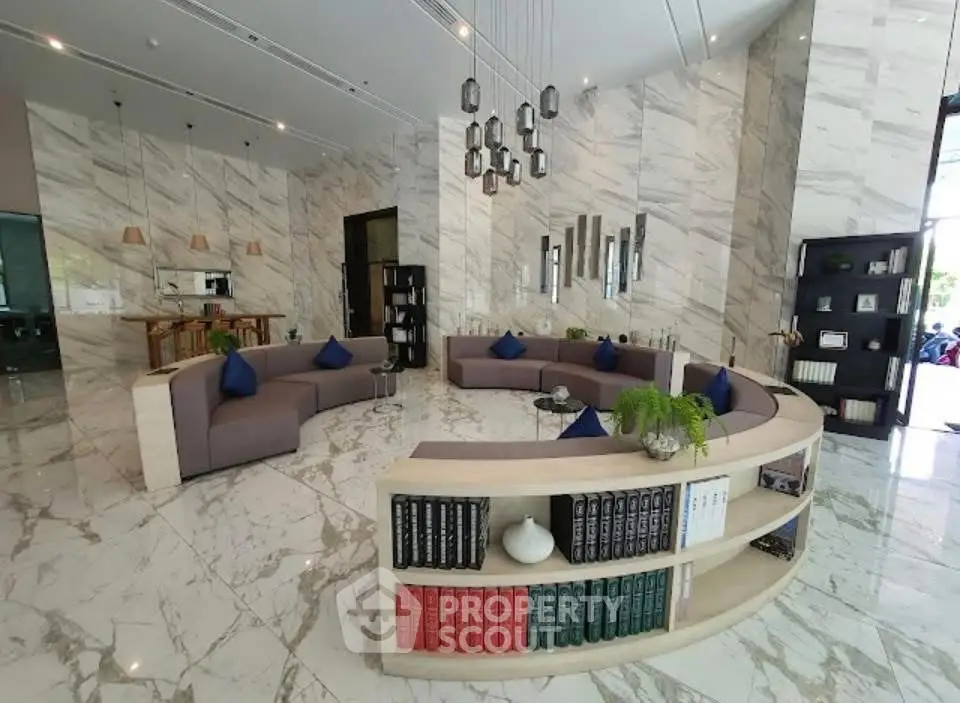 Luxurious modern living room with elegant marble flooring and stylish circular seating arrangement.