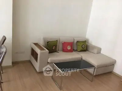 Modern living room with stylish beige sofa and sleek coffee table