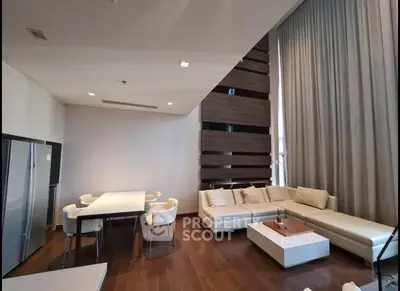 Luxurious modern living room with high ceilings and elegant decor