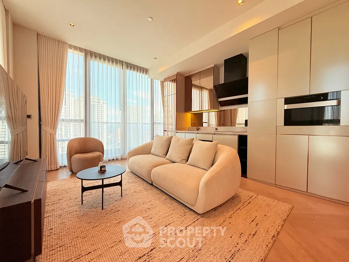 Luxurious modern living room with open kitchen and stunning city view.