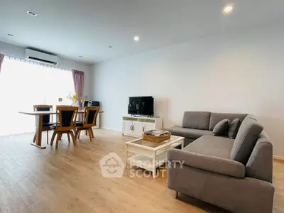 Spacious living room with modern furniture and natural light