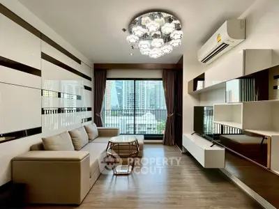 Modern living room with city view, stylish furniture, and elegant lighting in a high-rise apartment.