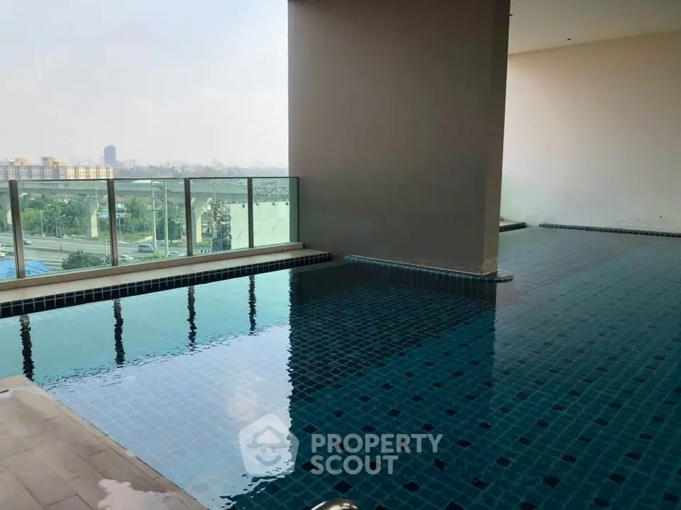 Luxurious indoor pool with stunning city view and modern design