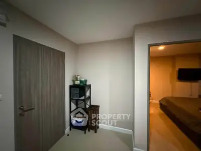 Cozy interior with modern bedroom and storage area, perfect for urban living.