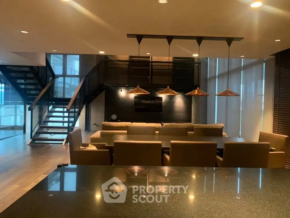 Luxurious modern living room with elegant lighting and stylish staircase