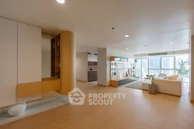 Spacious modern living room with open layout and city view