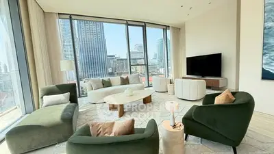 Luxurious modern living room with panoramic city views and stylish furniture.