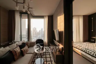 Luxurious modern living room with city view, elegant decor, and adjacent stylish bedroom.