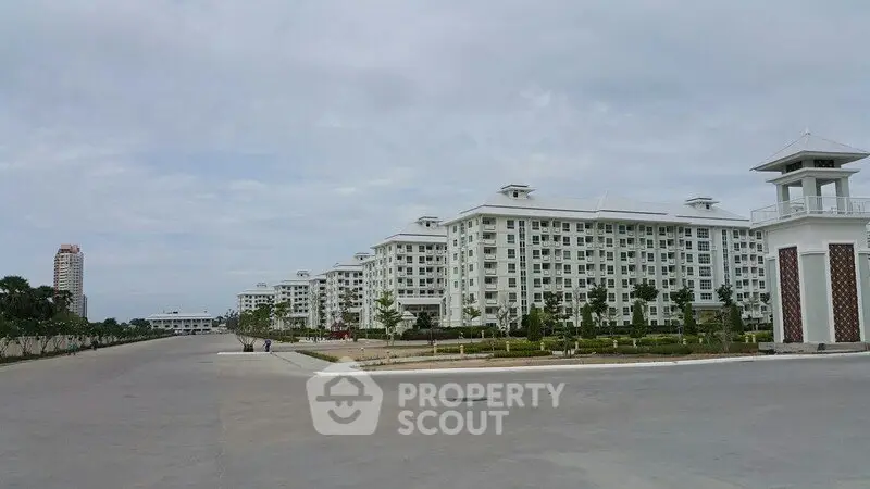 Spacious residential complex with modern architecture and landscaped surroundings.