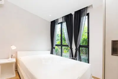 Bright and airy bedroom with large windows and modern decor