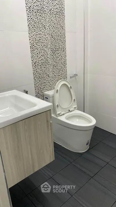 Modern bathroom with stylish tile design and sleek fixtures