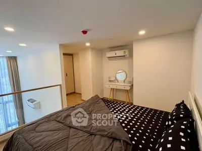 Modern bedroom with stylish decor and large window view in a high-rise apartment.