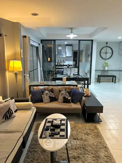 Spacious modern living room with stylish decor and open kitchen layout
