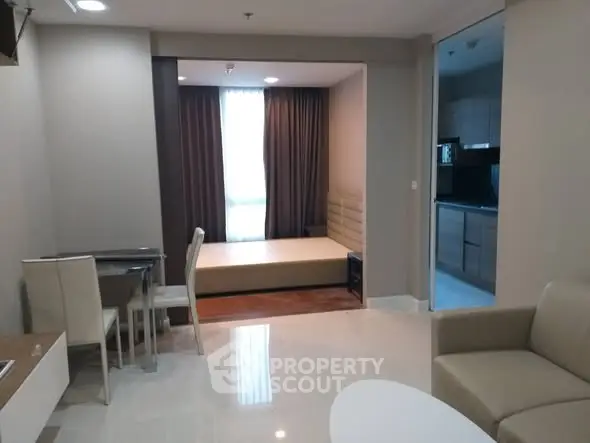 Modern studio apartment with open living area and kitchen