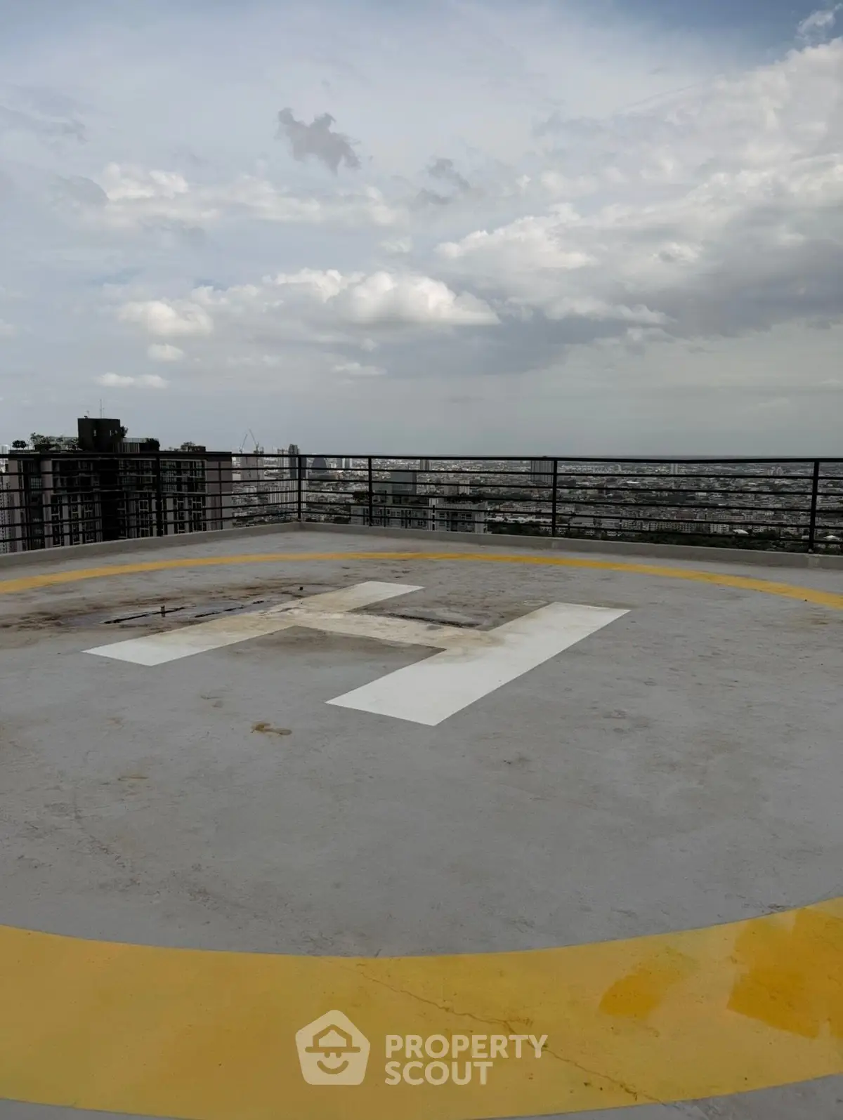 Stunning rooftop helipad with panoramic city views, perfect for luxury urban living.