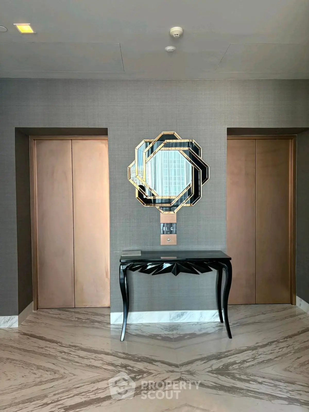 Luxurious modern elevator lobby with elegant mirror and console table