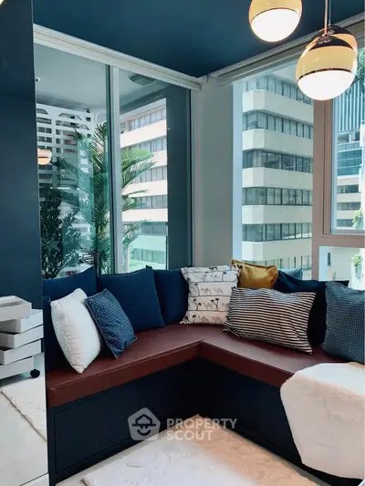 Modern living room with stylish corner sofa and city view