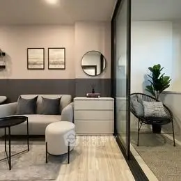 Modern living room with stylish decor and cozy balcony seating area.