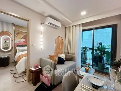 Stylish modern living room with balcony and bedroom view, featuring elegant decor and cozy ambiance.