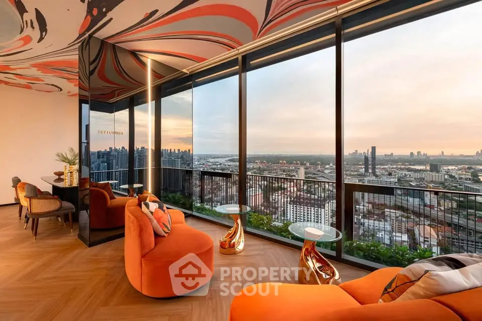 Luxurious high-rise living room with panoramic city views and stylish modern decor.