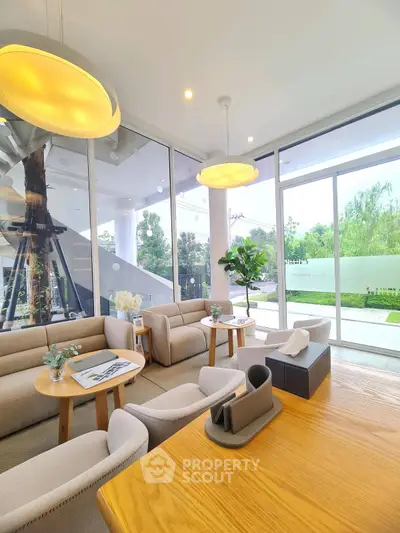 Modern living room with large windows and stylish furniture