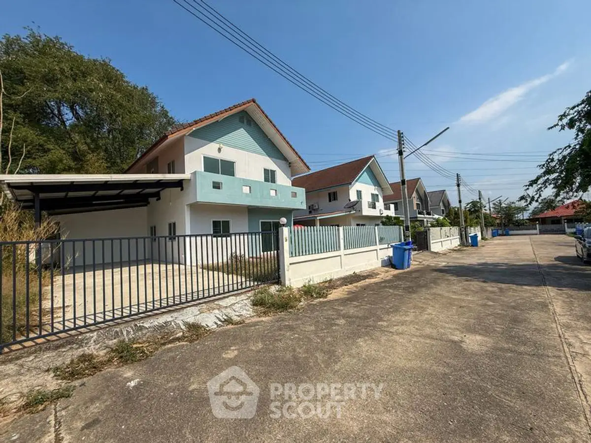 Charming suburban homes with spacious driveways and modern architecture in a peaceful neighborhood.