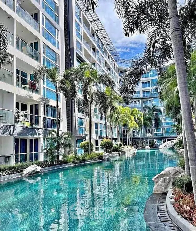 Luxurious condominium with stunning pool and lush palm trees