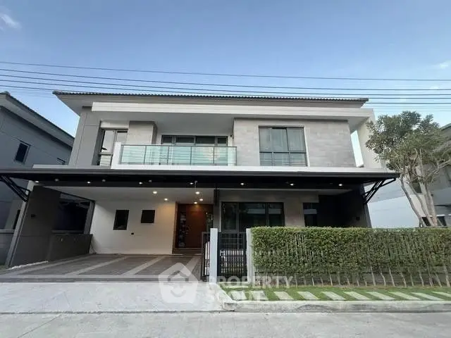 Modern two-story house with sleek design and spacious driveway