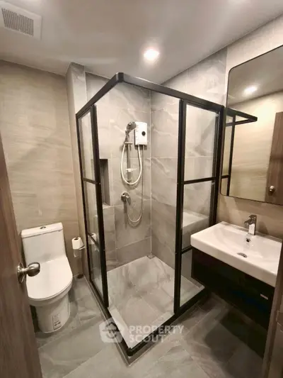 Modern bathroom with sleek shower enclosure and contemporary fixtures