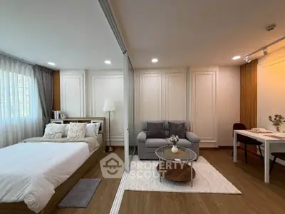 Modern studio apartment with cozy living area and elegant decor